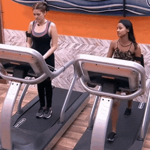 Two women working out in the gym 