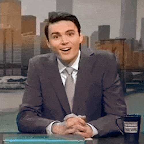 A news anchor at a desk reacts with a wide-eyed, shocked expression.