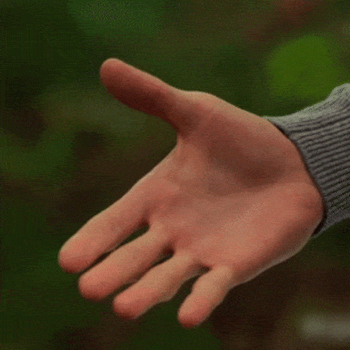 GIF of a hand reaching out for a handshake.