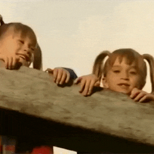 Twin sisters giggling 