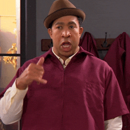 A man gesturing being on a call.