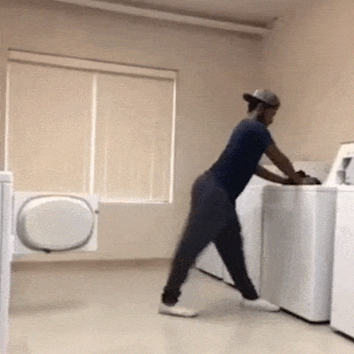 Man dancing and doing laundry