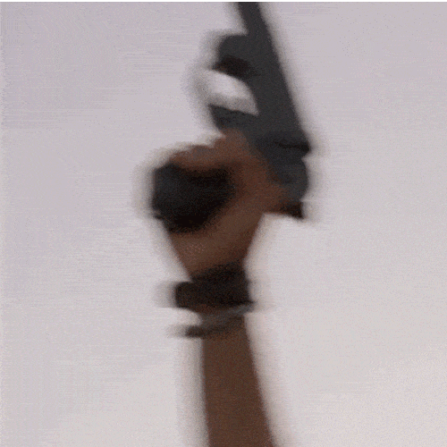 A hand fires a flare gun, and a bright trail of smoke shoots into the sky.