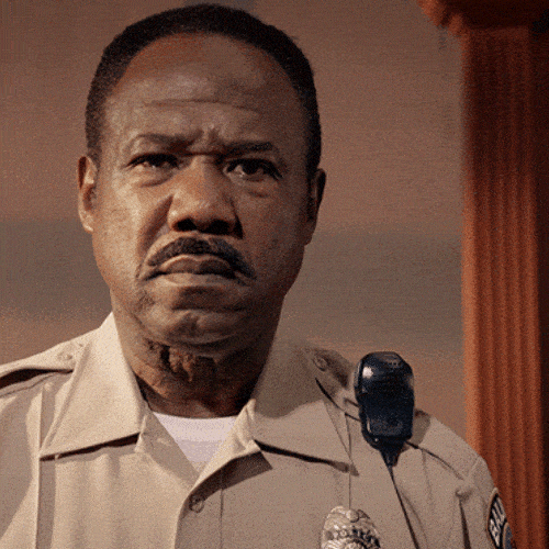 Man in a uniform with a deep frown and furrowed brow