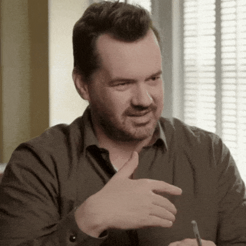 Man gesturing with his hand as if he is guessing