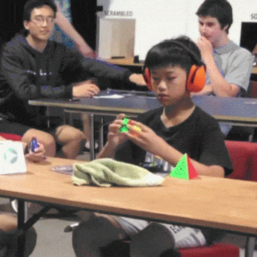 Young boy solving a Rubik's cube quickly