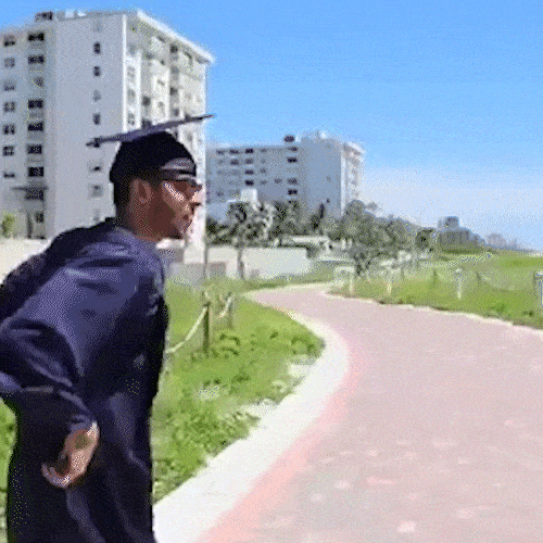 Graduate dancing excitedly