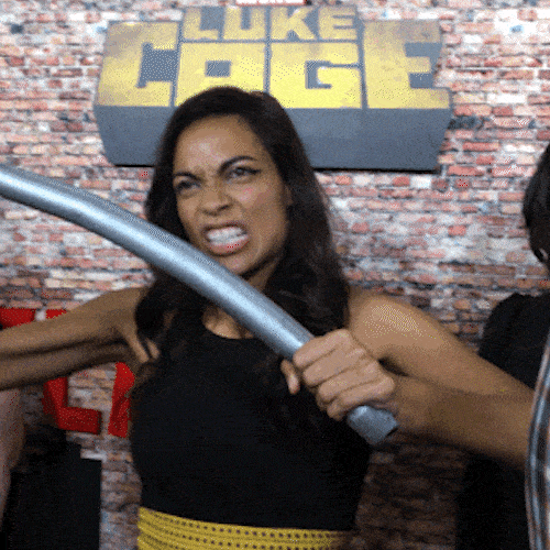 Woman bending a metal bar, symbolizing strength and resilience