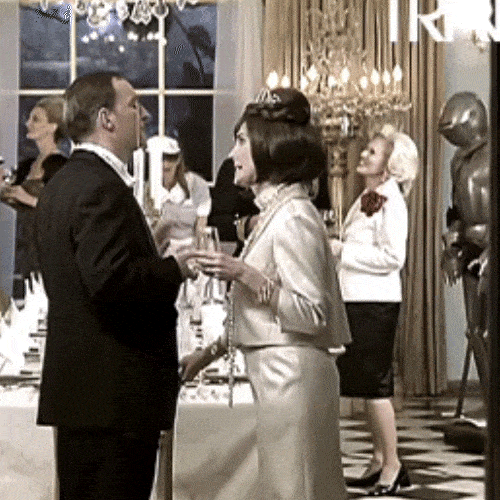 People at a party looking uncomfortably at the camera