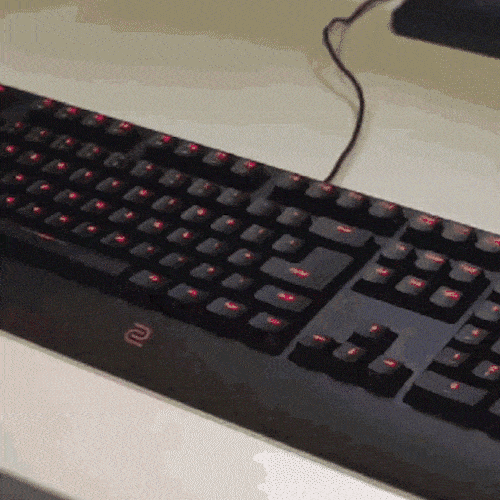 Man typing on keyboard with a lot of energy