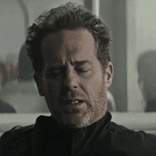 A man looks exhausted and tiredly nods his head