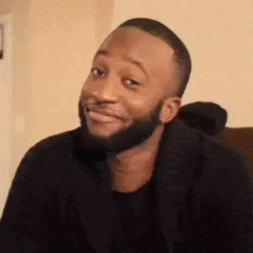 Person smiling knowingly and tilting head as if saying &ldquo;I told you&rdquo;