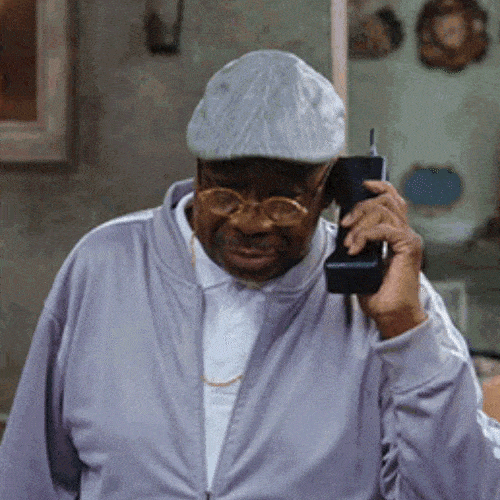 Older man talking on a large mobile phone