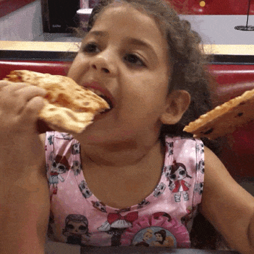 Girl enjoying a slice of pizza