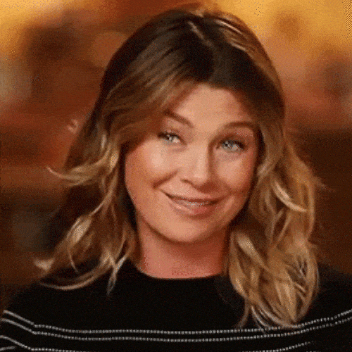 Woman raising her eyebrows with a slight smile