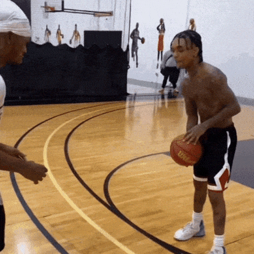 Basketball player passing the ball to another player during practice
