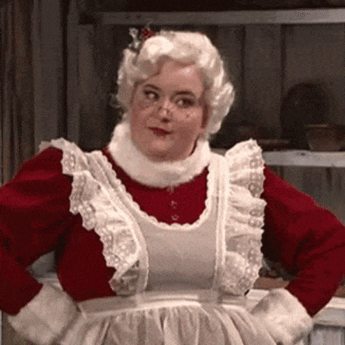 Woman in a costume standing with hands on hips